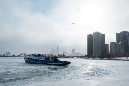 The James J. Versluis, a 90-foot icebreaker tugboat, breaks ice through Lake Michigan in Chicago, Illinois, U.S., January 29, 2019. REUTERS/Pinar Istek