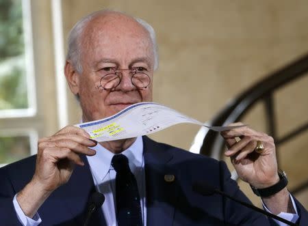 U.N. mediator for Syria Staffan de Mistura holds a paper with information on U.N. Inter-Agency humanitarian operations in Syria in 2016 during a news conference after a Syria peace talks meeting at the United Nations in Geneva, Switzerland, April 21, 2016. REUTERS/Denis Balibouse