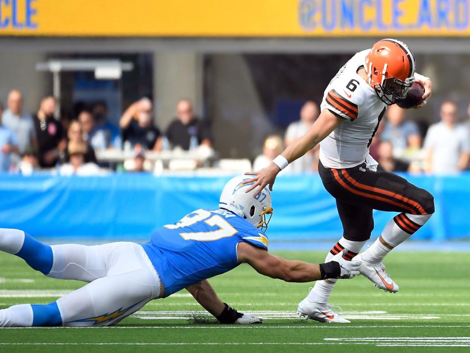 Baker Mayfield escapes a tackle against the Los Angeles Chargers.