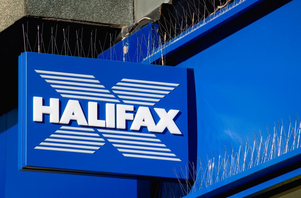 Business. Finance. Banking. Halifax sign on high street bank building with metal pigeon control spikes above it. (Photo by: Pauleheult/Eye Ubiquitous/Universal Images Group via Getty Images)