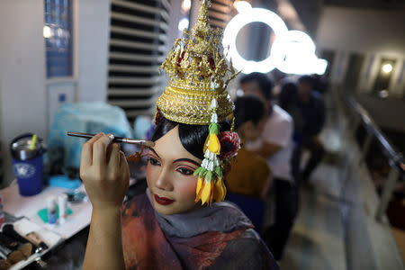 Dancers get ready backstage before a performance of masked theatre known as Khon which was recently listed by UNESCO, the United Nations' cultural agency, as an intangible cultural heritage, along with neighbouring Cambodia's version of the dance, known as Lakhon Khol at the Thailand Cultural Centre in Bangkok, Thailand November 7, 2018. REUTERS/Athit Perawongmetha