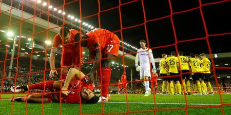 Football Soccer - Liverpool v Borussia Dortmund - UEFA Europa League Quarter Final Second Leg - Anfield, Liverpool, England - 14/4/16 Liverpool's Emre Can lies on the goal line after sustaining an injury Reuters / Darren Staples Livepic EDITORIAL USE ONLY. - RTX2A0S0