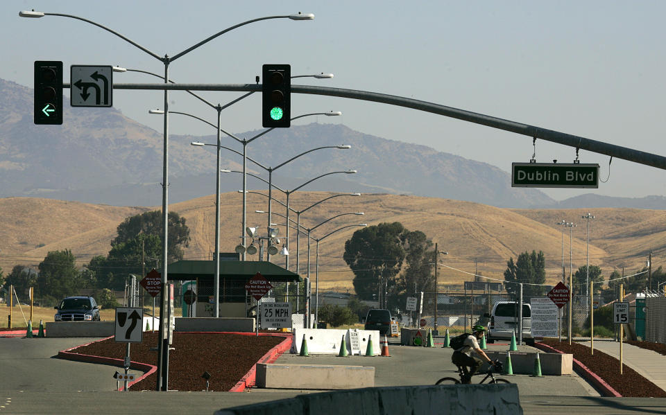 FILE - This July 20, 2006, file photo, shows the entrance to Camp Parks, which houses the Federal Correctional Institution in Dublin, Calif. A representative for Felicity Huffman Tuesday, Oct. 15, 2019, says the actress has reported to the federal prison in California to serve a two-week sentence in the college admissions scandal. (AP Photo/Ben Margot, File)