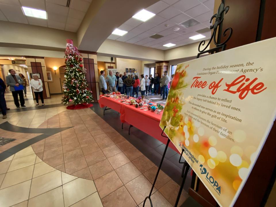 Personalized ornaments remembering organ donors sit on a table Thursday morning, ready to be placed on the Louisiana Organ Procurement Agency's (LOPA) Tree of Life at Rapides Regional Medical Center.