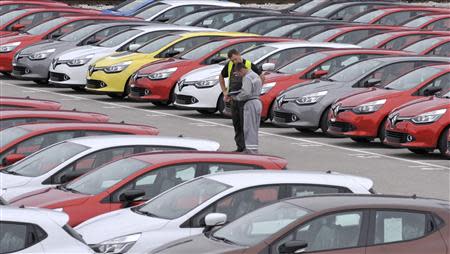 Renault cars produced in Turkey and awaiting export throughout Europe, are checked by workers in the port of Koper October 14, 2013. REUTERS/Srdjan Zivulovic