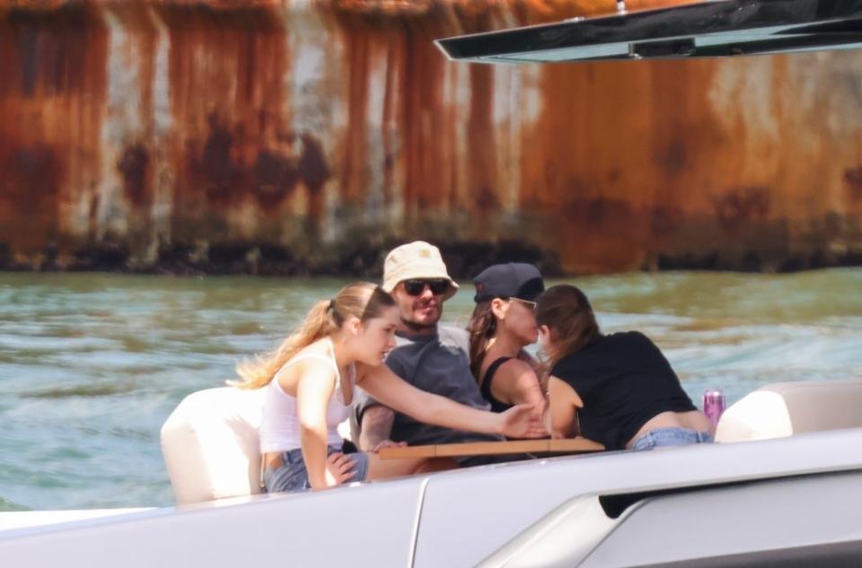 David and Victoria Beckham were spotted with their daughter Harper as they drove a speedboat to their megayacht. Mega / BACKGRID
