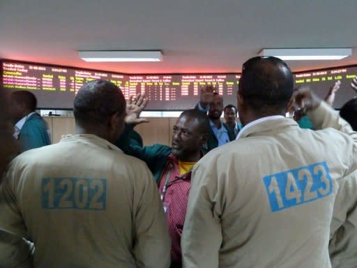 Coffee traders shop for deals on the floor of the Ethiopian Commodities Exchange (ECX) in Addis Ababa on May 31, 2013. Established in 2008, the ECX trades only in coffee, sesame seeds and green beans