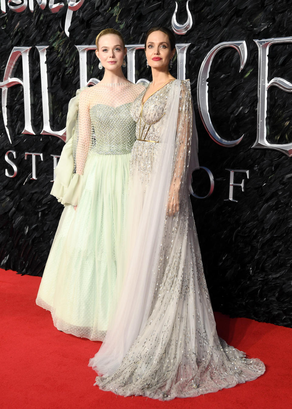 Angelina Jolie wears custom Ralph & Russo while Elle is ethereal in an Armani Prive number. <em>[Photo: Getty]</em>
