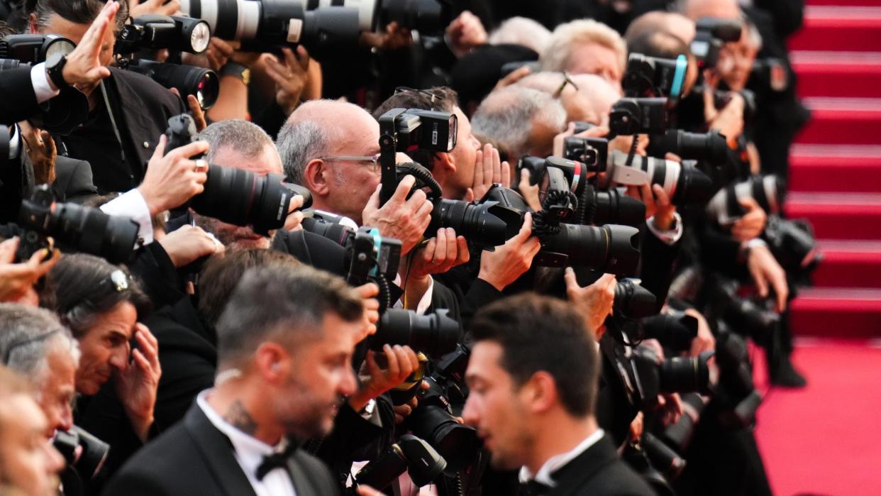 General view of photographers during the closing ceremony red carpet for the 75th annual Cannes film festival 