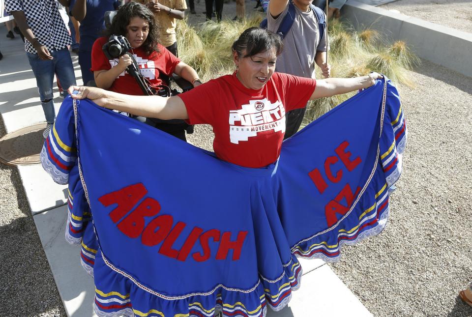 Immigration activists march in protest against the Maricopa County Sheriff and Immigration and Customs Enforcement at the county jail in an ongoing effort to get immigration authorities out Wednesday, Aug. 22, 2018, in Phoenix. (AP Photo/Ross D. Franklin)