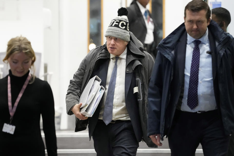 Britain's former Prime Minister Boris Johnson leaves after the COVID Inquiry at Dorland House in London, Thursday, Dec. 7, 2023. Johnson rejected suggestions that he wanted to let COVID-19 "rip" through the population as he defended his handling of the pandemic during a second day of testimony at a public inquiry into the crisis. (AP Photo/Kirsty Wigglesworth)