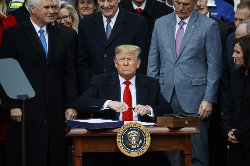 President Donald Trump prepares to sign a new North American trade agreement with Canada and Mexico, during an event at the White House, Wednesday, Jan. 29, 2020, in Washington. (AP Photo/Alex Brandon)