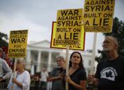 The "Act now to stop war and end racism" (ANSWER) coalition holds a rally outside the White House in Washington, August 29, 2013. The group rallied their opposition to U.S.-led military action on Syria. REUTERS/Jason Reed (UNITED STATES - Tags: POLITICS CIVIL UNREST)