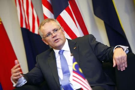 Australia's Minister of Immigration and Border Protection Scott Morrison speaks at a news conference during his working visit to Malaysia, at the Malaysian Maritime Enforcement Agency office in Putrajaya February 5, 2014. REUTERS/Samsul Said/Files