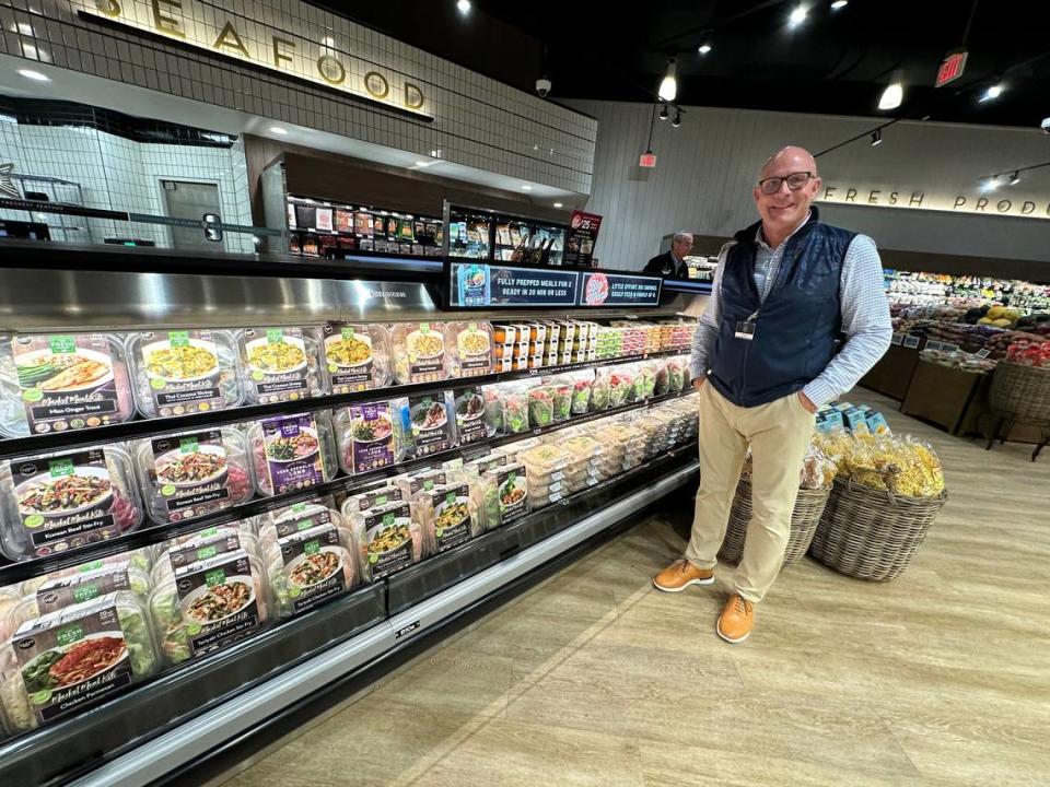 Todd Kerscher, regional manager for The Fresh Market, stands with an aisle offering complete meals ready to serve with a minimum of preparation at home. The Fresh Market opened its newest store Wednesday morning, 4/24/2024, at 11525 S.R. 70 E. , Lakewood Ranch.