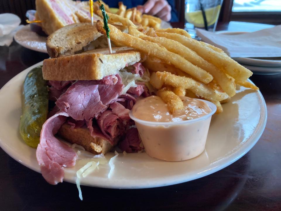 The Mad Reuben at Mavis Winkle's Irish Pub in Twinsburg is served with a pickle, fries and Thousand Island dressing on the side.