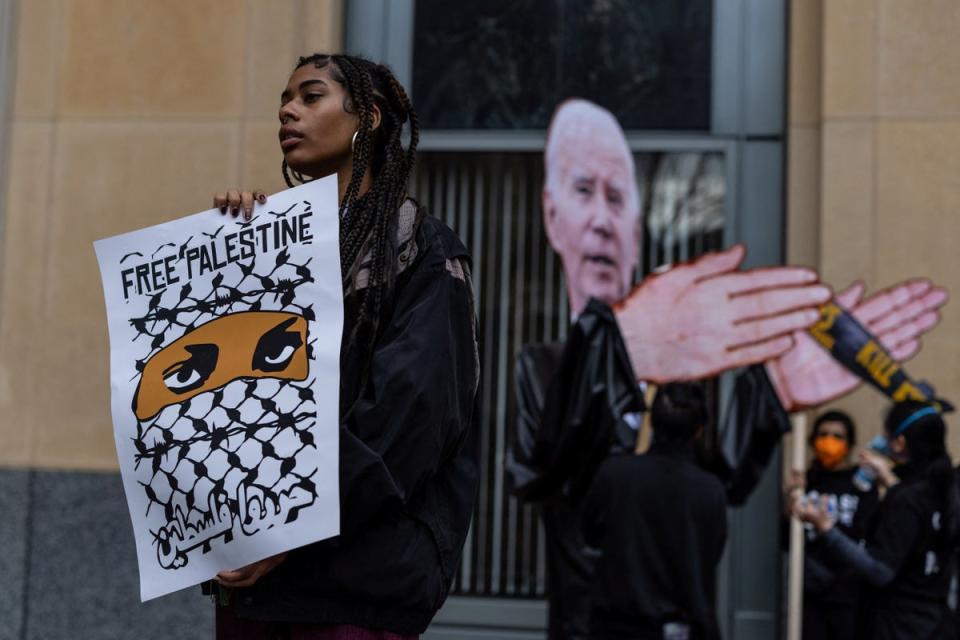 Protesters demonstrate outside a federal court in Oakland, California, during a hearing in a lawsuit alleging President Joe Biden’s complicity in Palestinian genocide. (REUTERS)