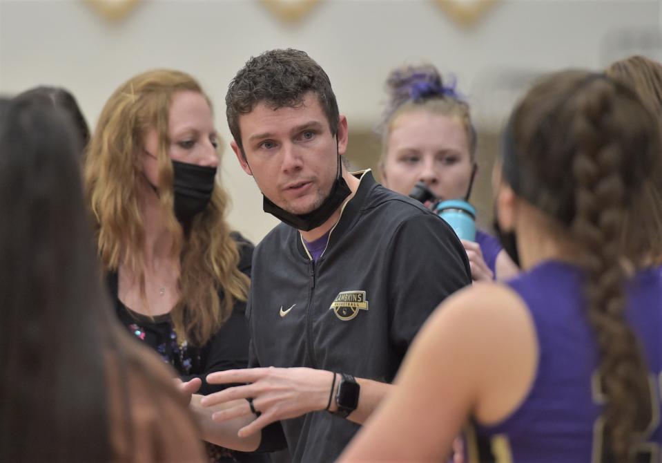 Matt Hower, the coach of Fort Collins High School's girls basketball team, talks to his players during a timeout in a game at Windsor on Tuesday, Dec. 14, 2021. Hower is stepping down after six seasons to become the director of operations for the University of Colorado women's basketball program.