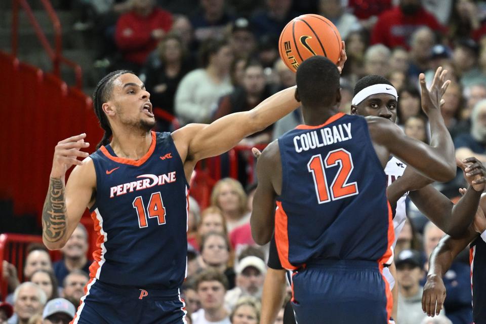 Pepperdine forward Jevon Porter, left, intercepts a pass in a January game against Gonzaga.