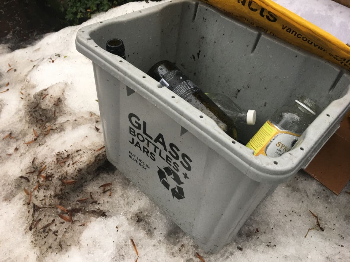 A grey bin for glass recycling out for collection after regular pickup was delayed in Vancouver due to a winter snow storm. (David Horemans/CBC - image credit)