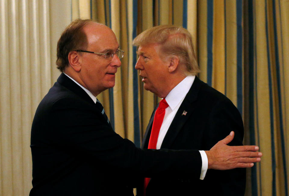 U.S. President Donald Trump talks with BlackRock CEO Larry Fink as he hosts a strategy and policy forum with chief executives of major U.S. companies at the White House in Washington February 3, 2017.  REUTERS/Kevin Lamarque