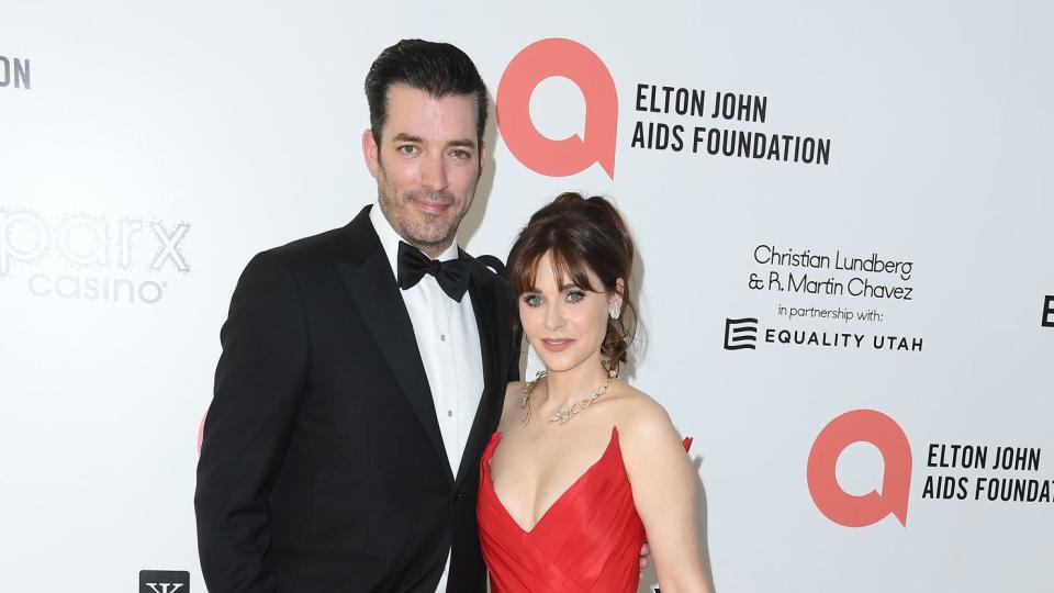 Jonathan Scott, Zooey Deschanel arrives at the Elton John AIDS Foundation's 30th Annual Academy Awards Viewing Party on March 27, 2022 in West Hollywood, California.
