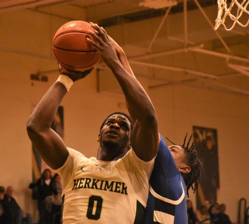 Herkimer General Oladele Oladitan, the NJCAA's Region III tournament most valuable player, puts up a shot against Fulton-Montgomery Community College in the championship game Sunday.