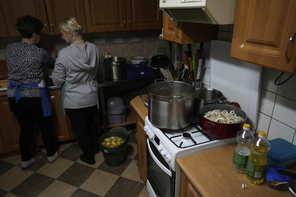 Members of a Muslim congregation cook soup for migrants at the Polish-Belarusian border in Bohoniki near Sokolka, Poland, Saturday, Nov. 13, 2021. (AP Photo/Matthias Schrader)