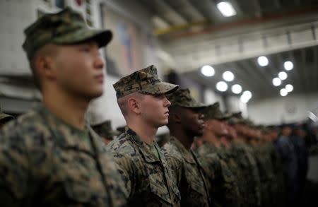 U.S. Marines aboard the USS Bonhomme Richard amphibious assault ship stand in formation during a ceremony marking the start of Talisman Saber 2017, a biennial joint military exercise between the United States and Australia aboard the USS Bonhomme Richard amphibious assault ship on the the Pacific Ocean off the coast of Sydney, Australia, June 29, 2017. REUTERS/Jason Reed