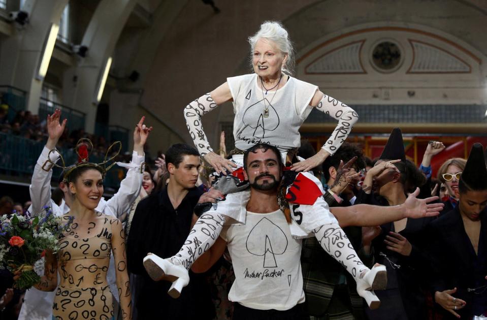 Vivienne Westwood is carried after her catwalk show at London Fashion Week Men’s 2017 (REUTERS)