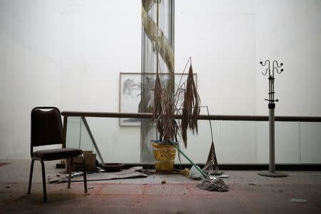 A chair, a broom and a hanger stand in the main hall of the abandoned Alps Ski Resort located near the demilitarised zone separating the two Koreas in Goseong, South Korea, January 17, 2018. REUTERS/Kim Hong-Ji