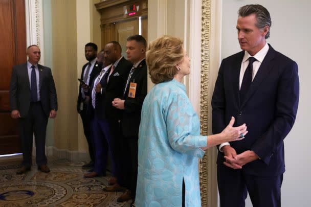 PHOTO: Gov. Gavin Newsom talks to Sen. Debbie Stabenow at the U.S. Capitol, July 14, 2022 in Washington, DC. (Alex Wong/Getty Images)