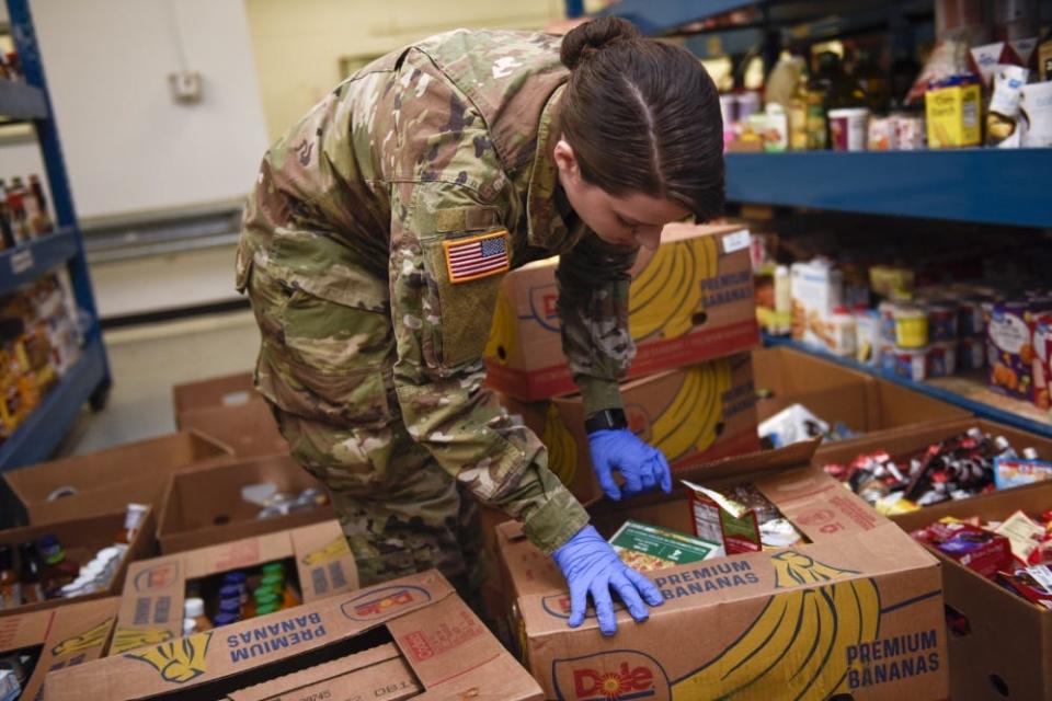 U.S. Army Spc. Kinnis White, a Soldier assigned to the Ohio National Guard’s 1-148th Infantry Regiment – 37th Infantry Brigade Combat Team, stocks shelves at the Toledo Northwestern Ohio Food Bank in Toledo, Ohio, March 24, 2020