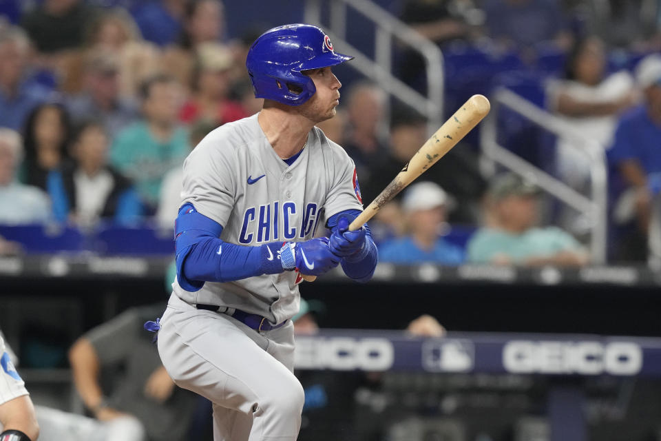 Chicago Cubs' Cody Bellinger watches his hit to left field during the seventh inning of a baseball game against the Miami Marlins, Friday, April 28, 2023, in Miami. (AP Photo/Marta Lavandier)