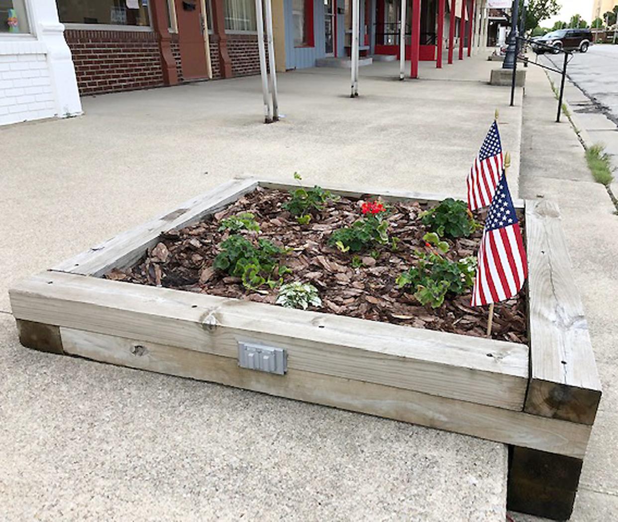 A downtown planter box is one of a number in Fairbury that will be cared for by Gomez Lawn Care after the city council approved a contract with the company at Wednesday's council meeting.