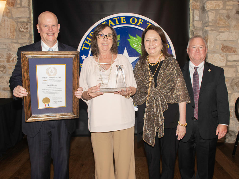 TBCJ Chairman Eric Nichols, Lori Riggs, Texas First Lady Cecilia Abbott and TDCJ Executive Director Bryan Collier (L-R), courtesy of The Texas Department of Criminal Justice