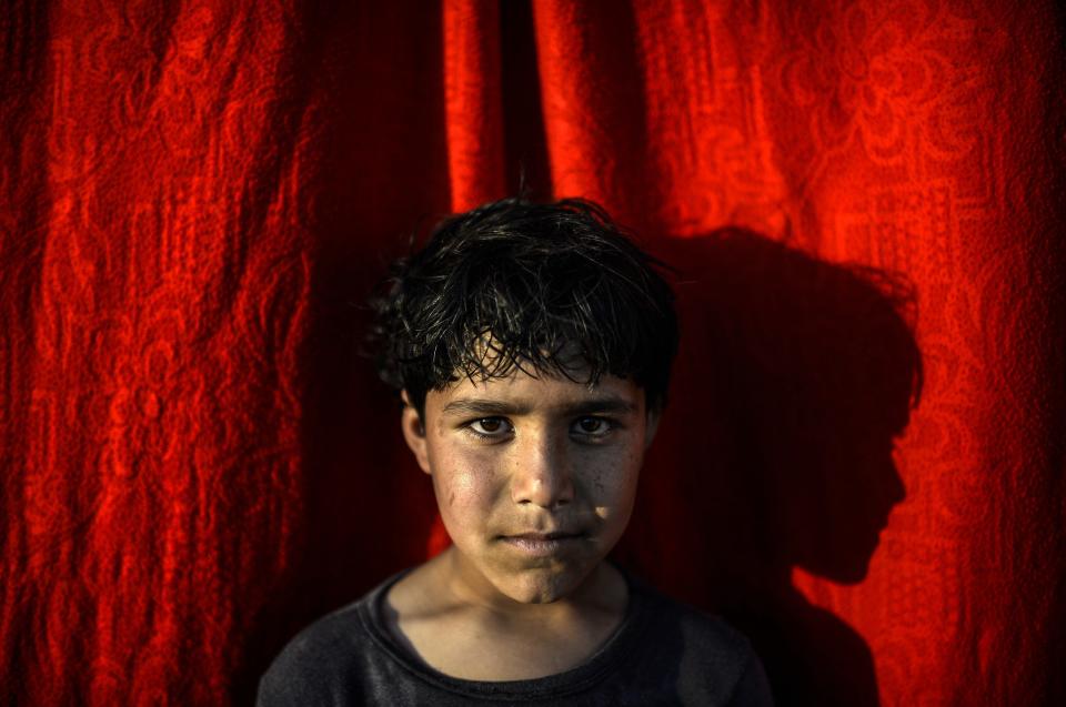 Arif,&nbsp;a 10-year-old Syrian Kurdish refugee, poses at the Rojava refugee camp in Sanliurfa, Turkey, on Feb. 1. As the <a href="http://www.huffingtonpost.com/2015/01/17/kurds-assad-syria-war_n_6492340.html">Syrian civil war</a> rages on and the self-described <a href="http://www.huffingtonpost.com/2014/12/04/isis-eastern-syria_n_6268372.html">Islamic State</a>&nbsp;grabs&nbsp;territory, millions of Syrians have been forced to leave their homes and seek refuge in other parts of the country or in neighboring&nbsp;states.