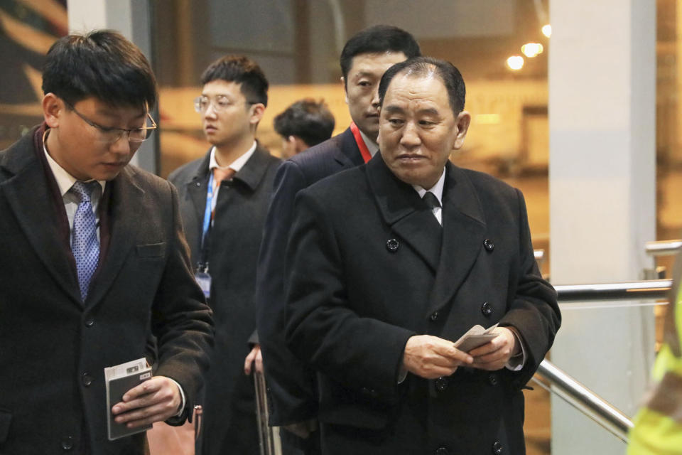 North Korean official Kim Yong Chol, right, prepares to leave the Beijing International Airport in Beijing Thursday, Jan. 17, 2019. Kim arrived in Beijing on Thursday, reportedly en route to the United States for talks ahead of a possible second summit between President Donald Trump and North Korean leader Kim Jong Un. (Kyodo News via AP)