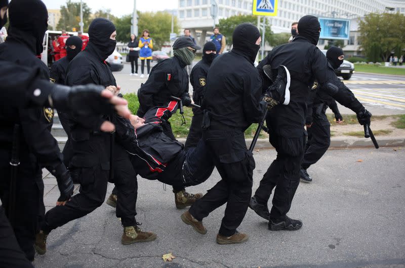 Belarusian opposition supporters hold a rally in Minsk