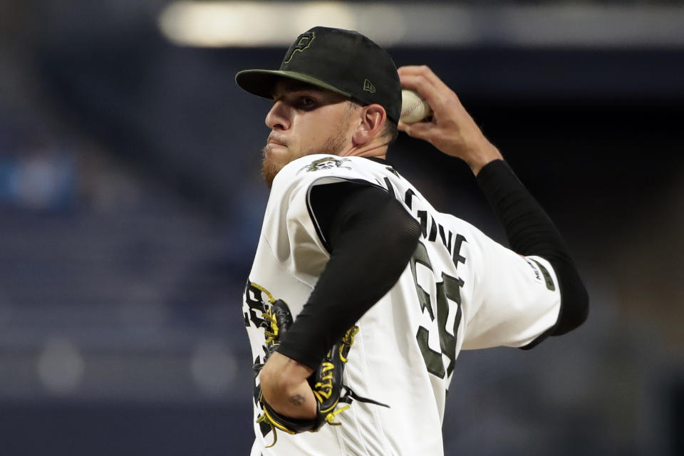 Pittsburgh Pirates starting pitcher Joe Musgrove delivers during the first inning of the team's baseball game against the Chicago Cubs in Pittsburgh, Thursday, Sept. 26, 2019. (AP Photo/Gene J. Puskar)