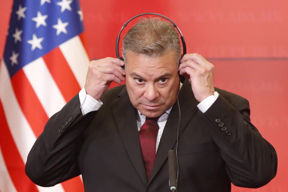 Gabriel Escobar, U.S. Deputy Assistant of the State for Balkan policy adjusts his earphones during a joint news conference with North Macedonia's Prime Minister Dimitar Kovacevski, at the Government building in Skopje, North Macedonia, on Friday, Aug. 25. 2023. The senior State Department official on Friday voiced hope that North Macedonia will be able to approve politically difficult changes to the constitution that would help its bid to join the European Union. (AP Photo/Boris Grdanoski)