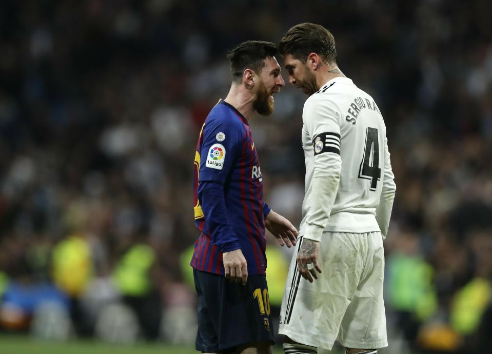 Barcelona forward Lionel Messi, left, goes head to head with Real defender Sergio Ramos after they argue during the Spanish La Liga soccer match between Real Madrid and FC Barcelona at the Bernabeu stadium in Madrid, Saturday, March 2, 2019. (AP Photo/Manu Fernandez)