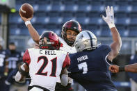 San Diego State quarterback Kaegun Williams, center, throws a first-down pass against Nevada during the second half of an NCAA college football game Saturday, Nov. 21, 2020, in Reno, Nev (AP Photo/Lance Iversen)