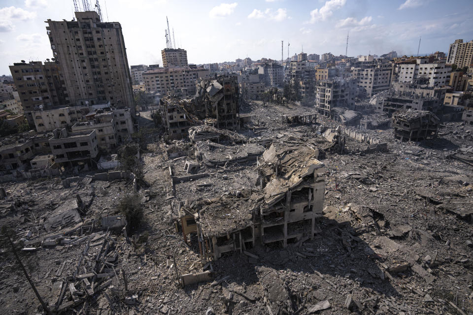 FILE - A view of the rubble of buildings hit by an Israeli airstrike, in Gaza City, on Oct. 10, 2023. After 11 weeks of war in Gaza, the Israeli military campaign against Hamas now sits among the deadliest and most destructive in history. The Palestinian death toll is approaching 20,000 and satellite data shows that one-third of structures across the tiny enclave have been destroyed. (AP Photo/Fatima Shbair, File)