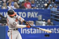 Baltimore Orioles' Ryan McKenna hits a pop single against the Toronto Blue Jays during the first inning of a baseball game Monday, Aug. 15, 2022, in Toronto. (Jon Blacker/The Canadian Press via AP)