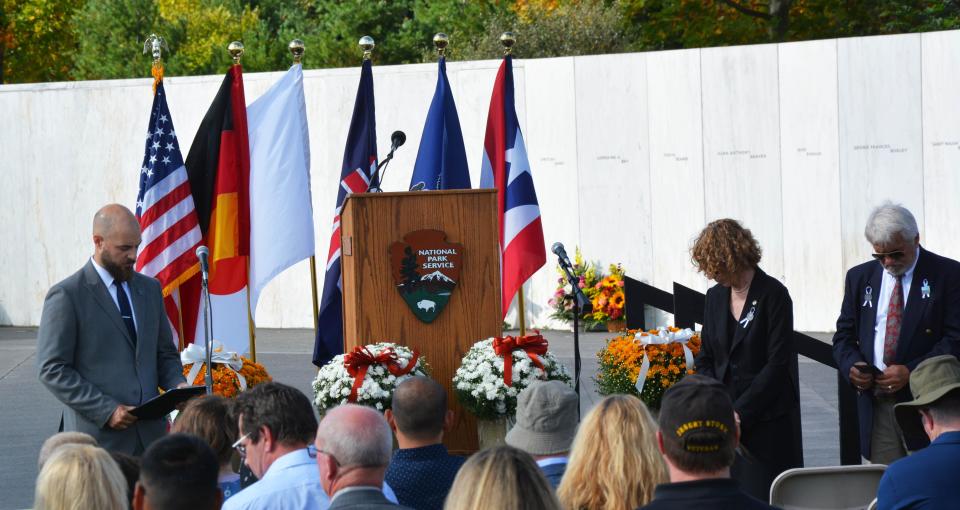 Jacob Miller, a 2003 graduate of Shanksville-Stonycreek School District, along with members of the families, read the names of the passengers and crew on United Flight 93 during Monday's Flight 93 National Memorial observance of Sept. 11, 2001.