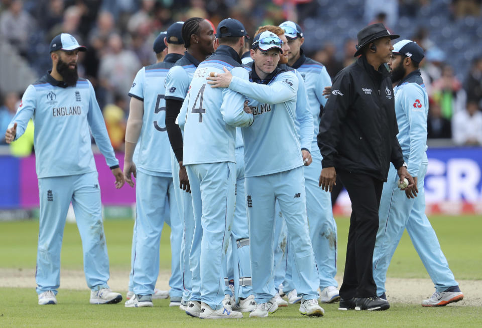 England players celebrate their win in the Cricket World Cup match against Afghanistan at Old Trafford in Manchester, England, Tuesday, June 18, 2019. (AP Photo/Rui Vieira)