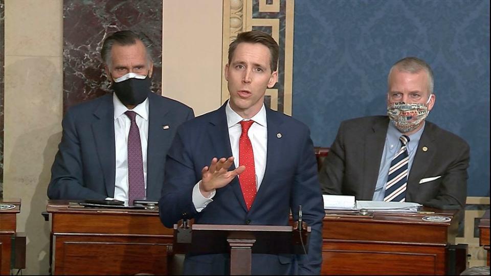 In this image from video, Sen. Josh Hawley, R-Mo., speaks as the Senate reconvenes to debate the objection to confirm the Electoral College Vote from Arizona, after protesters stormed into the U.S. Capitol on Wednesday, Jan. 6, 2021.