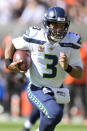 Seattle Seahawks quarterback Russell Wilson rushes for a 16-yard touchdown during the first half of an NFL football game against the Cleveland Browns, Sunday, Oct. 13, 2019, in Cleveland. (AP Photo/David Richard)