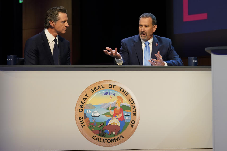 Gubernatorial candidates Democratic Gov. Gavin Newsom, left, and Republican challenger state Sen. Brian Dahle spar during their debate held by KQED Public Television in San Francisco, Sunday, Oct. 23, 2022. (AP Photo/Rich Pedroncelli, Pool)